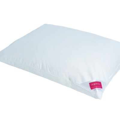 A plain white rectangular pillow with a small red and white brand label reading HEFEL on one corner, on a white background.