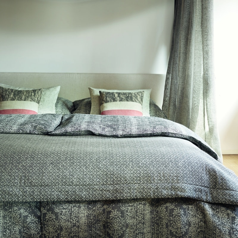 A bed with a canopy in a bedroom.