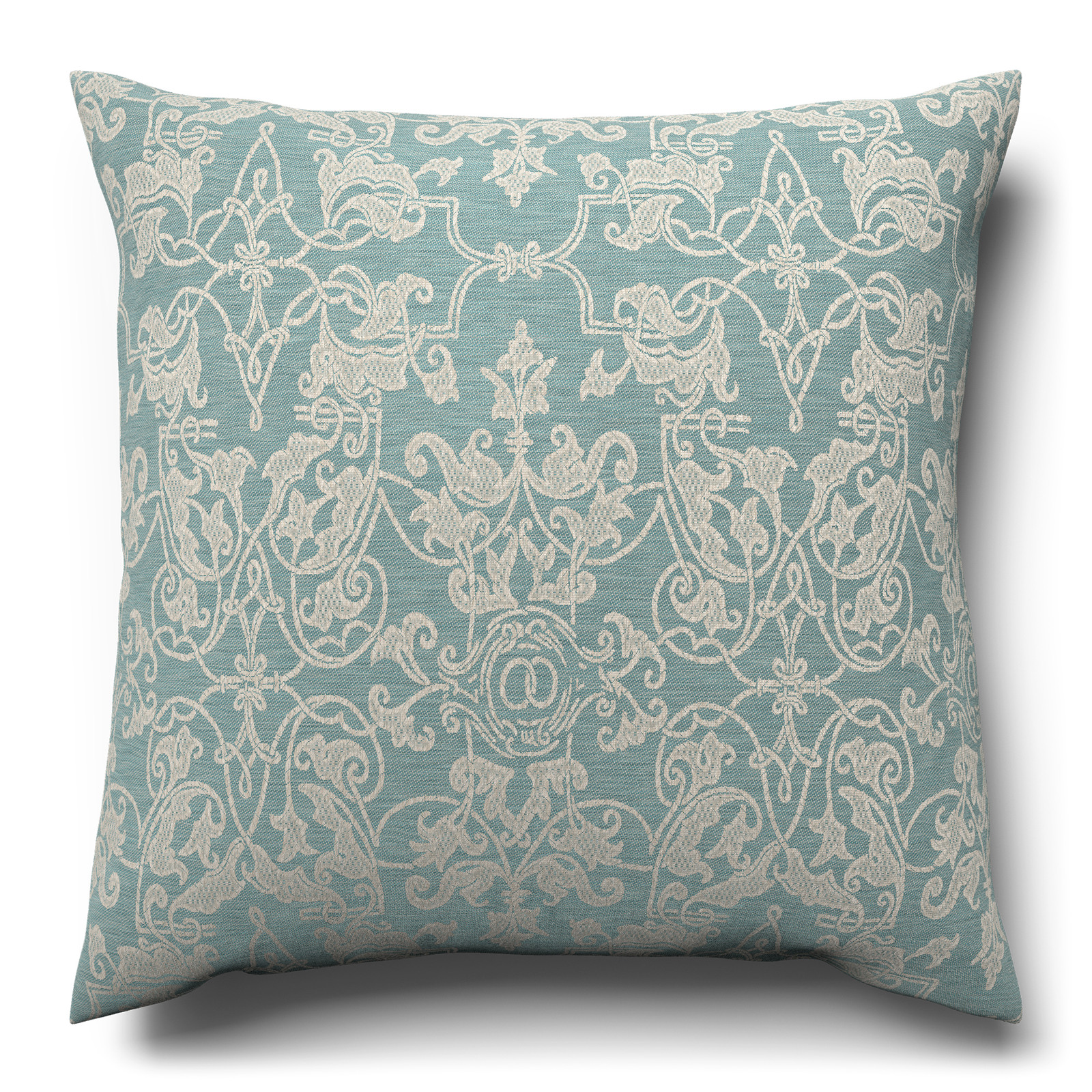 A blue and white cushion with an intricate pattern.