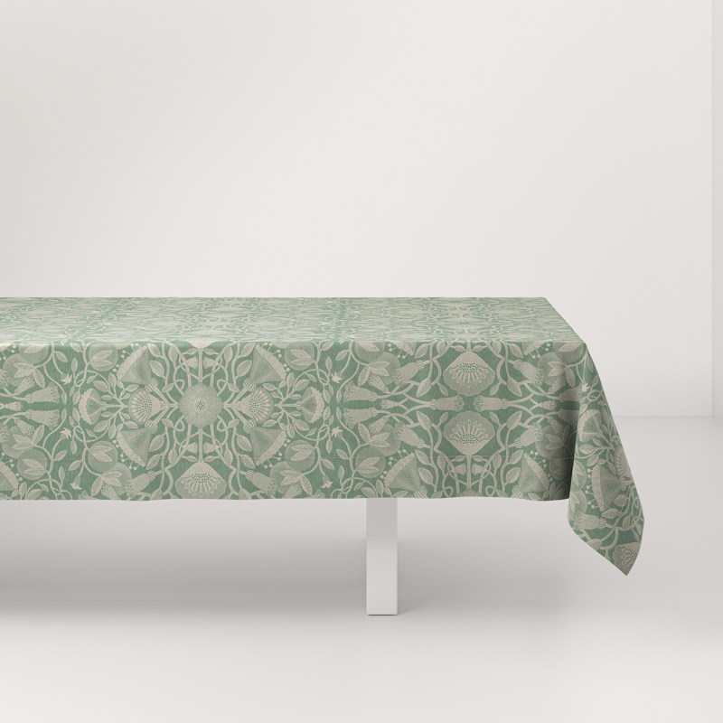 A table with a green tablecloth on it.
