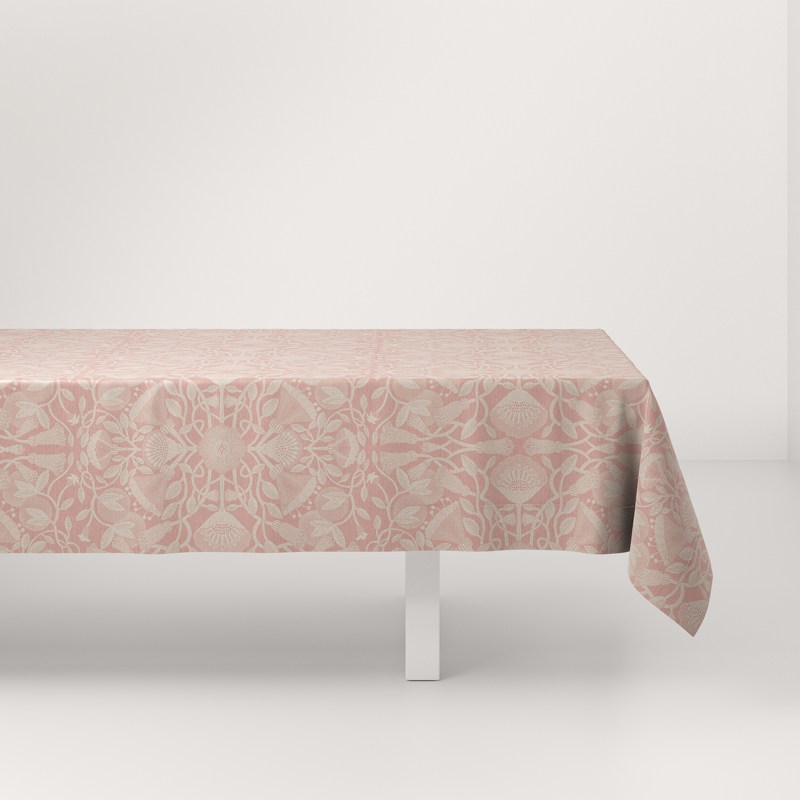 A table with a pink tablecloth on it.