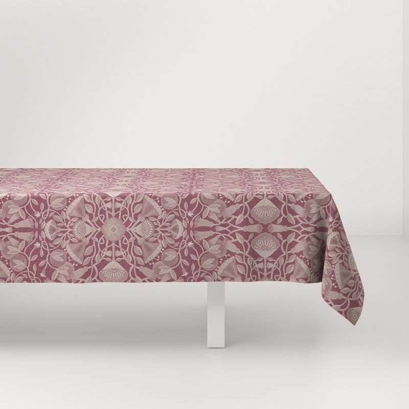 A table with a pink tablecloth on it.