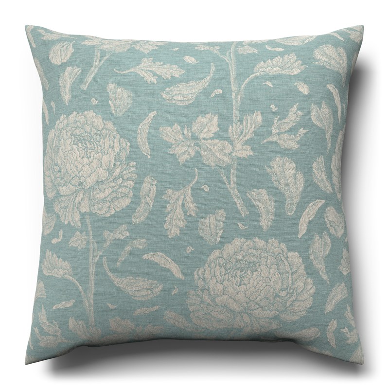 A blue and white cushion with a floral pattern.