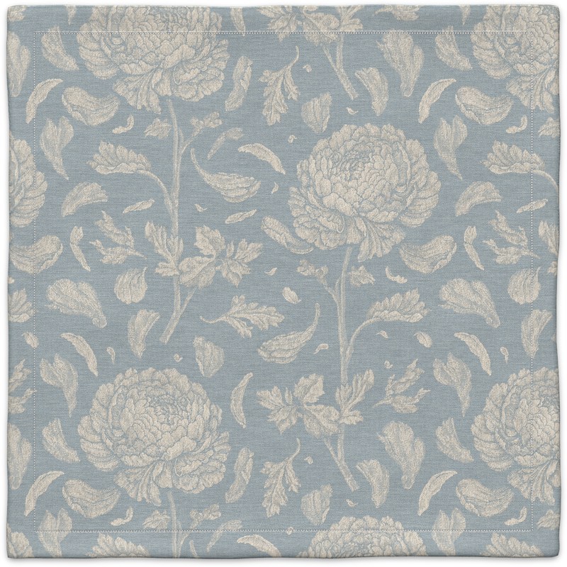 A blue and white floral pattern on a linen background.