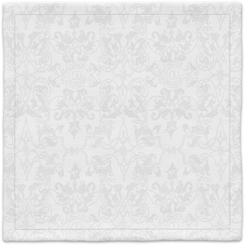 A white placemat with a floral pattern.