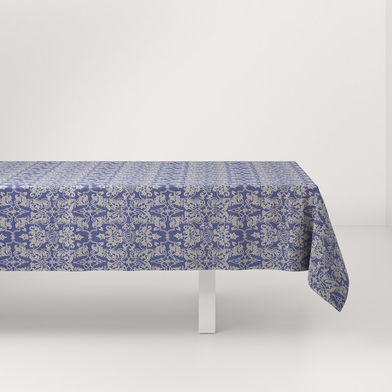 A blue and white tablecloth on a white table.