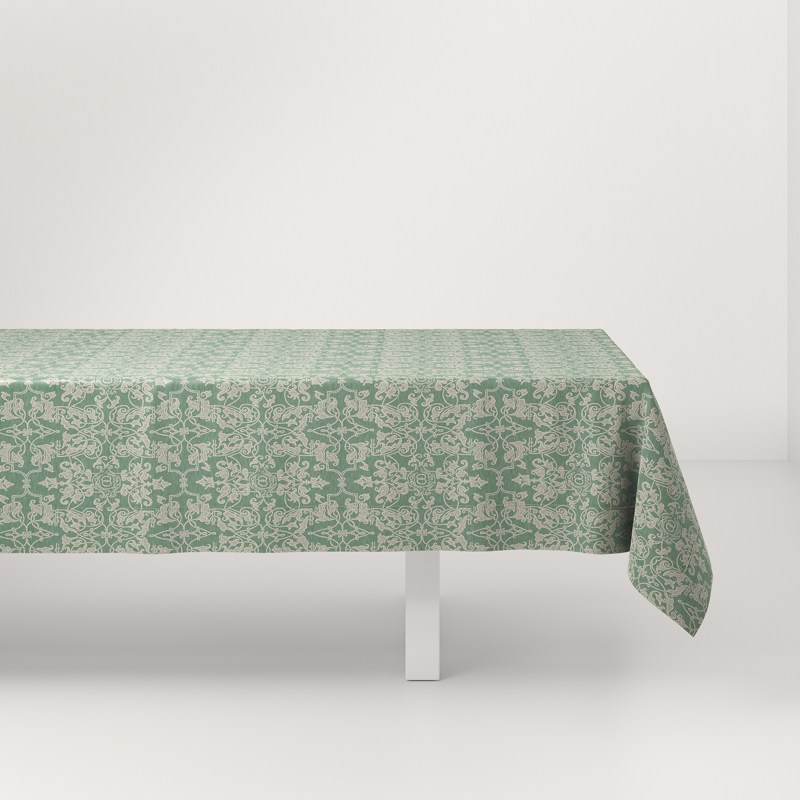 A table with a green tablecloth on it.