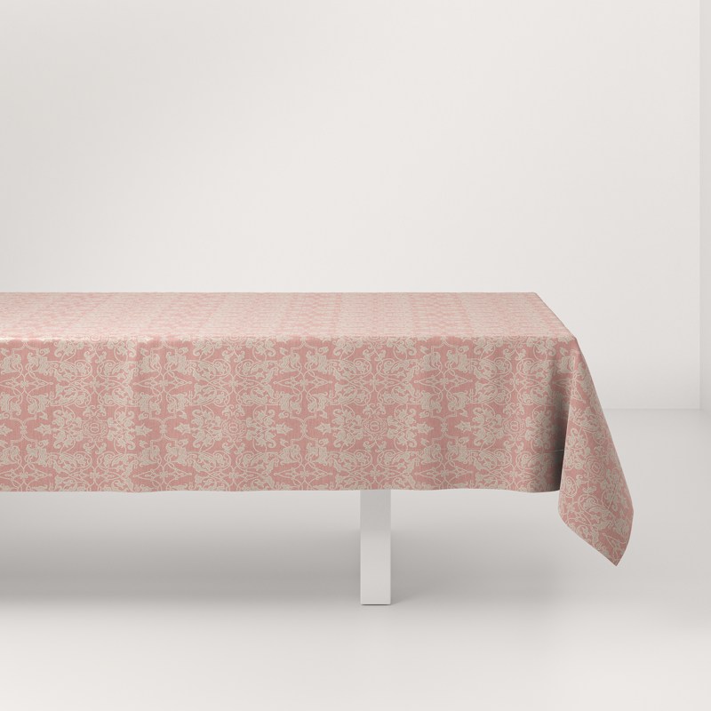 A table with a pink tablecloth on it.