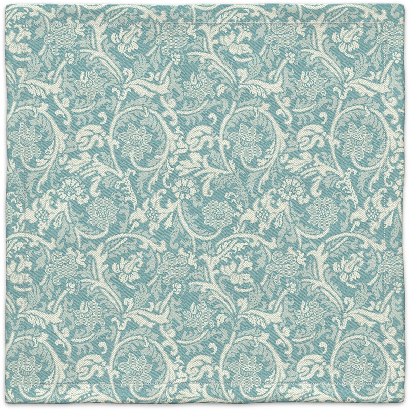 A blue and white carpet with a floral pattern.