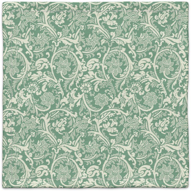 A green and white carpet with a floral pattern.