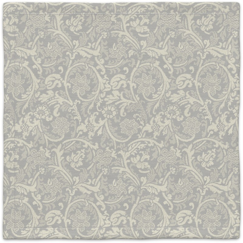 A gray and white carpet with a floral pattern.