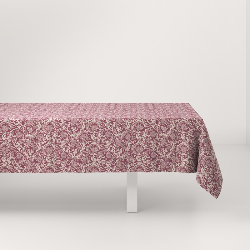 A table with a pink tablecloth on it.
