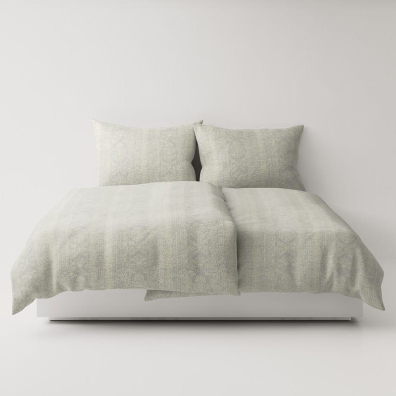 A bed with two pillows on top.