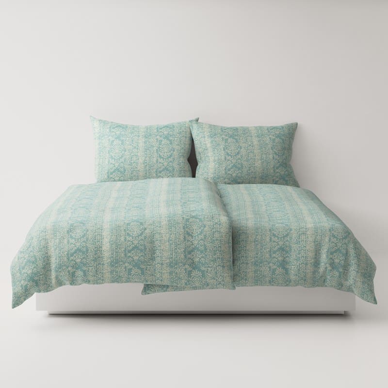 A bed with two pillows on top.