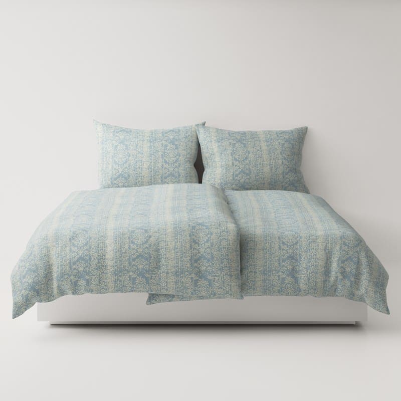 A bed with two pillows on top.