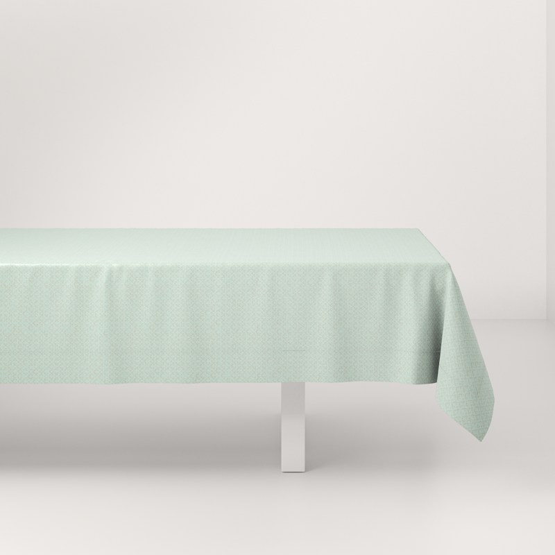 A table with a light green tablecloth on it.
