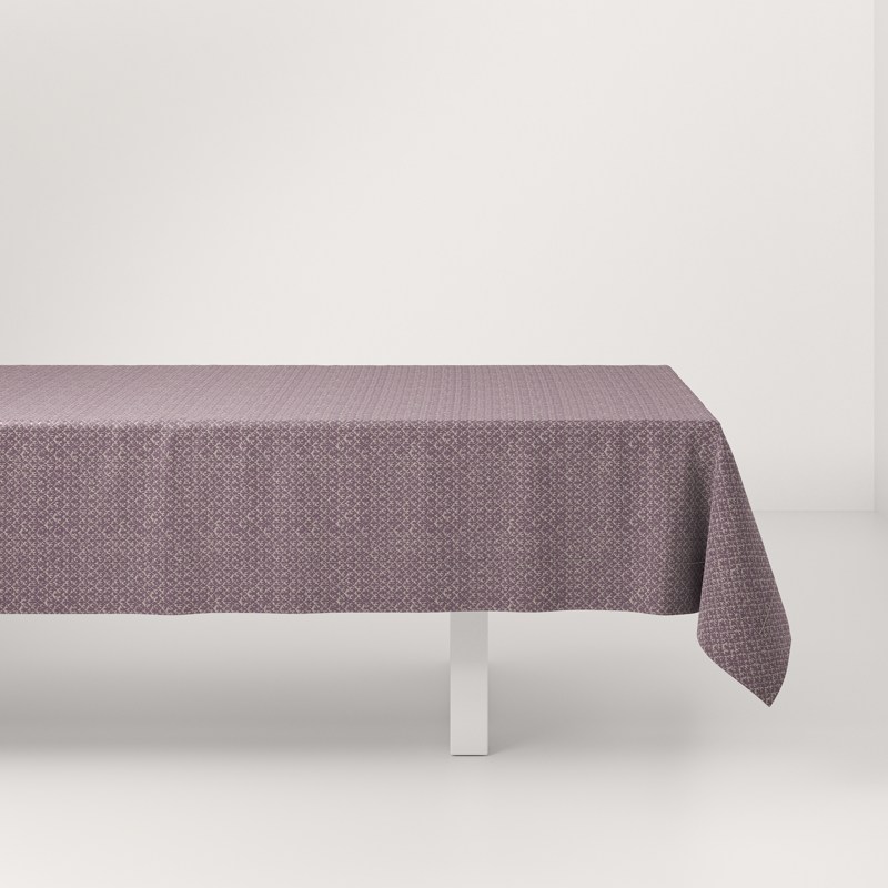 A table with a purple tablecloth on it.