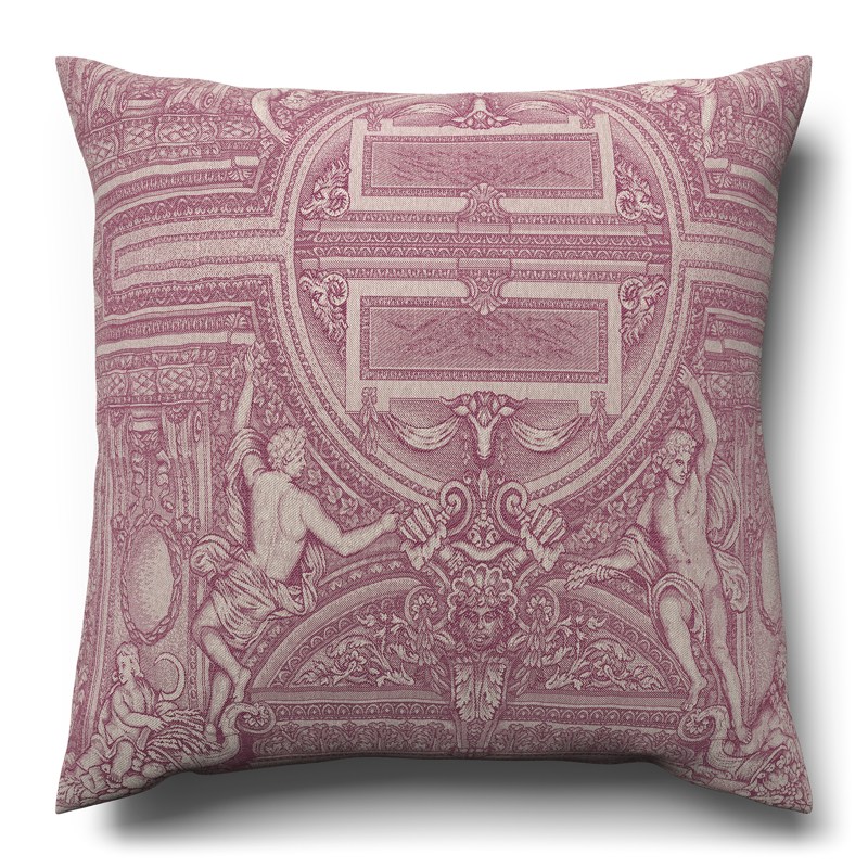 A pink cushion with a decorative pattern on it.
