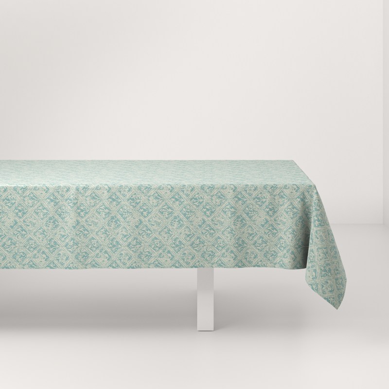 A table with a green tablecloth on it.