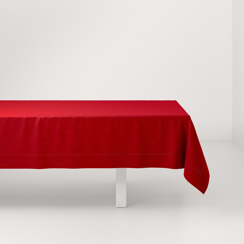 A red tablecloth on a white table.