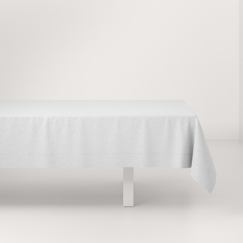 A white table with a white tablecloth on it.