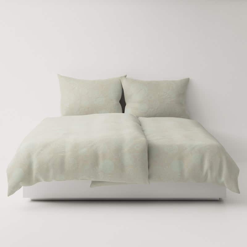 A bed with two pillows on top.