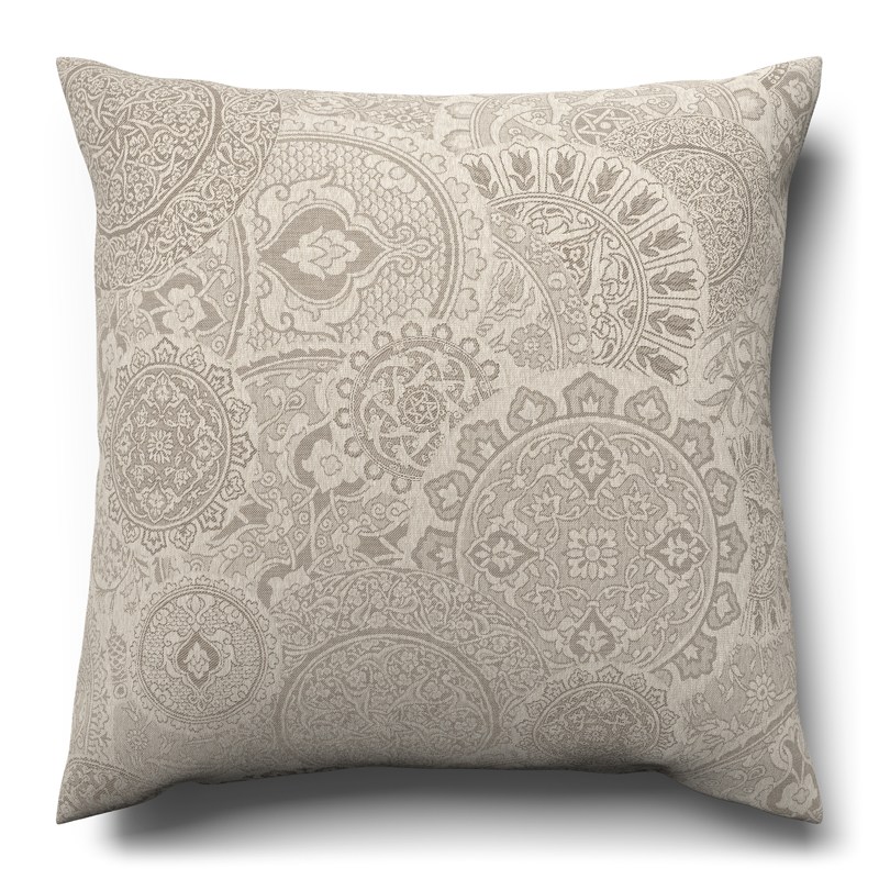 A white cushion with a paisley pattern on it.