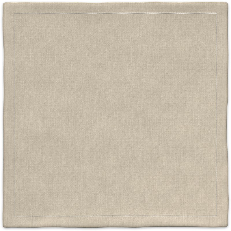 A beige placemat with a white border.