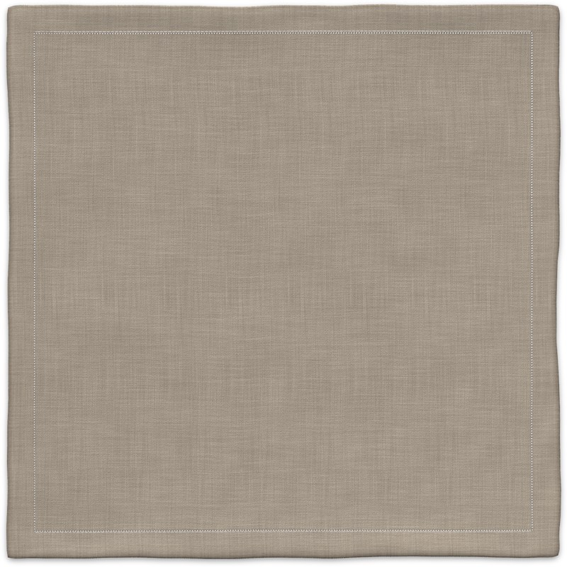 A beige placemat with a white border.