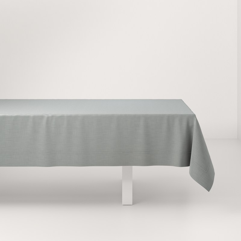 A table with a gray tablecloth on it.