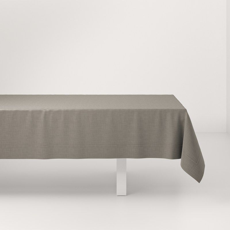 A table with a long tablecloth on it.