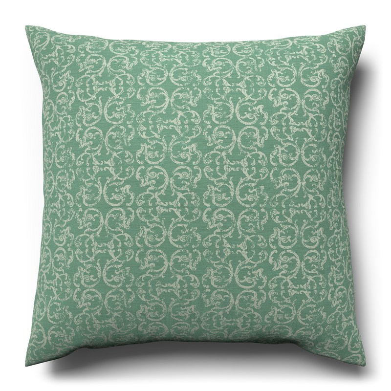 A green cushion with a white pattern on it.