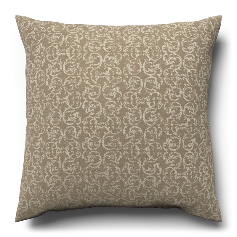 A beige cushion with a decorative pattern on it.
