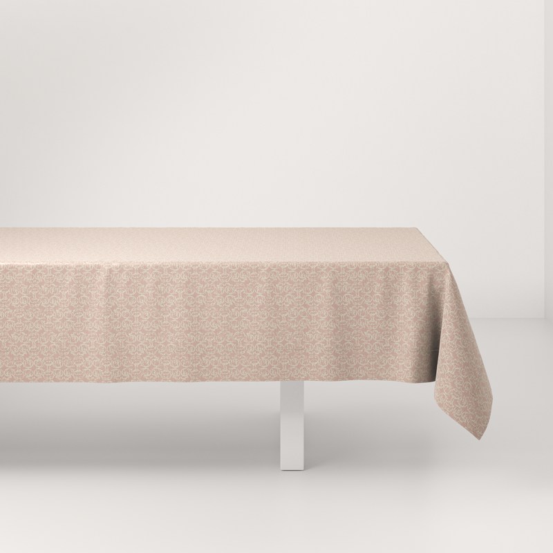 A table with a beige tablecloth on it.