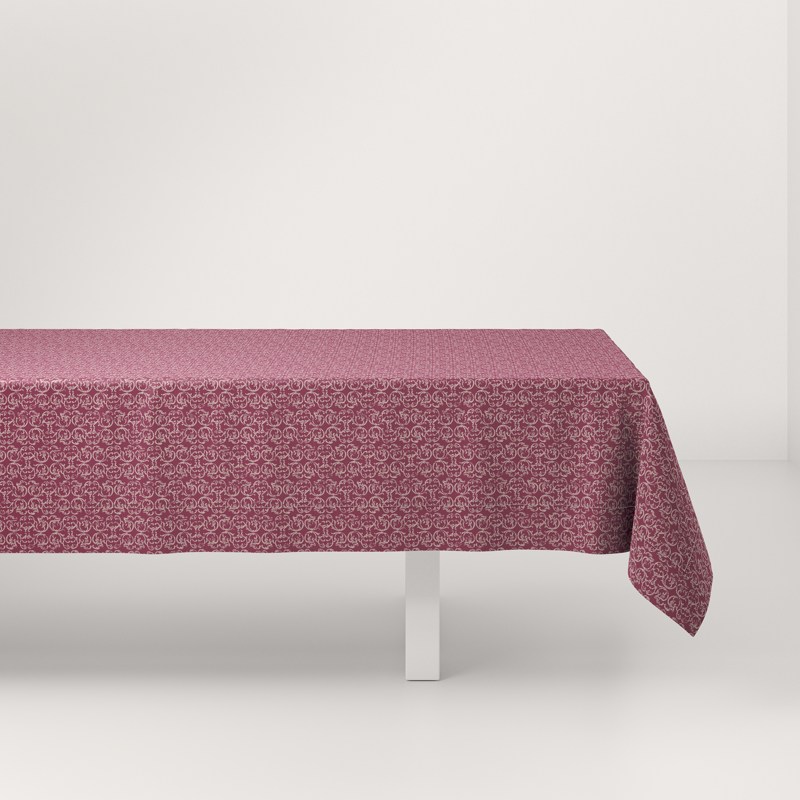 A pink tablecloth on a white table.