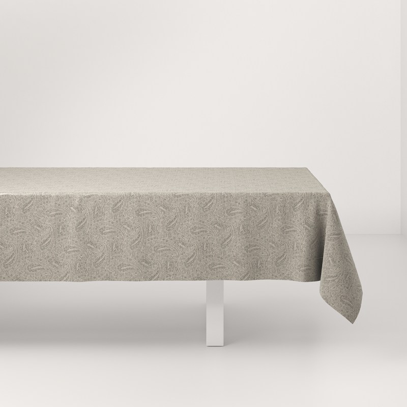 A white table with a gray tablecloth on it.