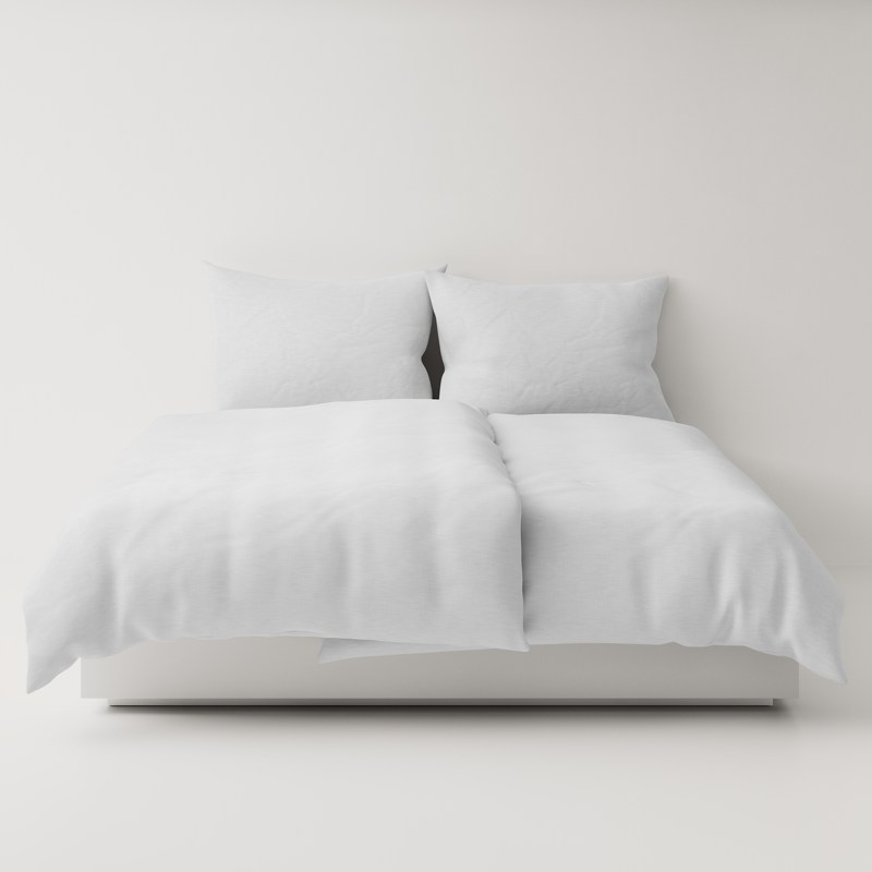 A bed with a white duvet and pillows.