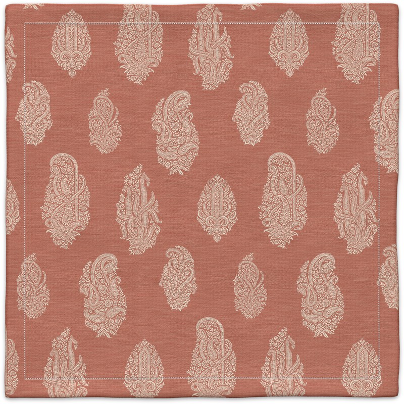 An orange and white pocket square with a paisley pattern.