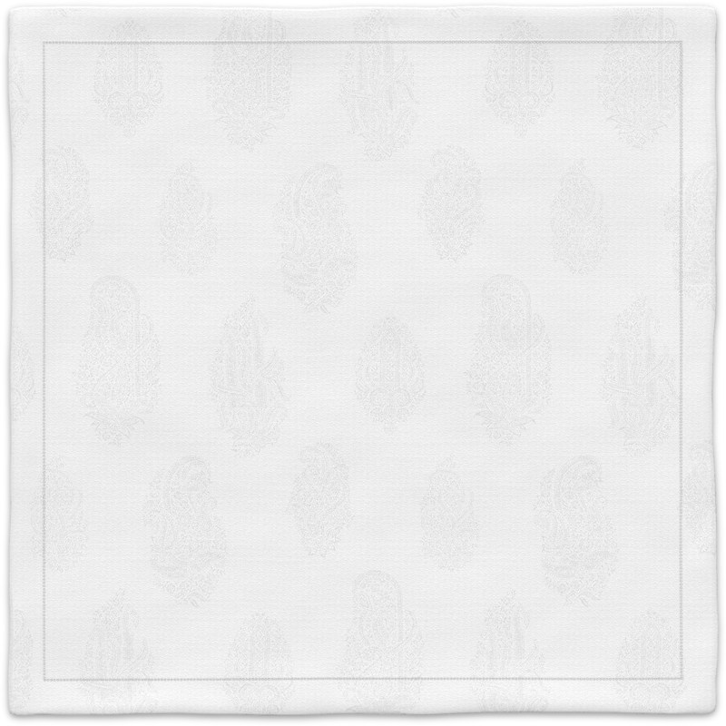 A white napkin with a paisley pattern on it.