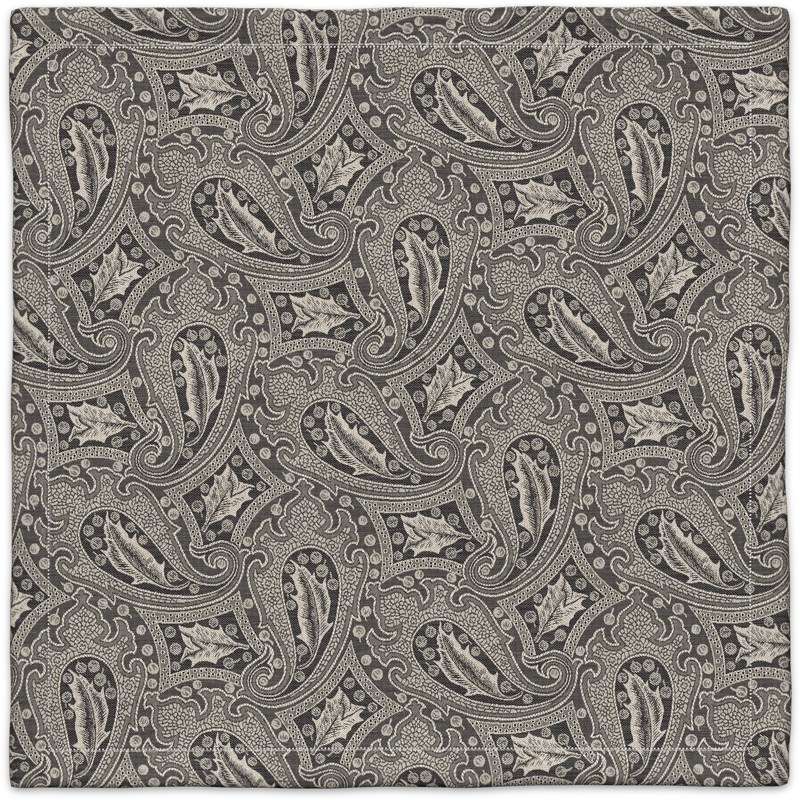 A black and white paisley pattern on a gray background.