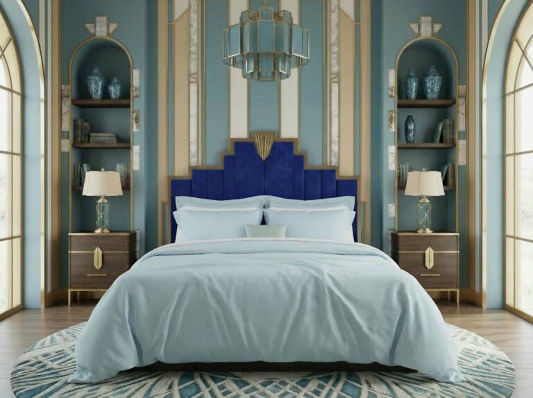Luxurious bedroom in blue and gold, with a tufted blue headboard, Esther pure linen bedding from Schlitzer Leinen, two bedside tables with lamps, shelves with vases, arched windows and a geometric rug.