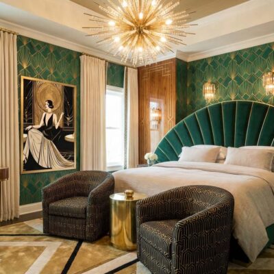 An Art Deco style bed with linen bedding