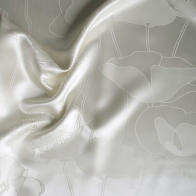 A white sheet with a floral pattern on it.