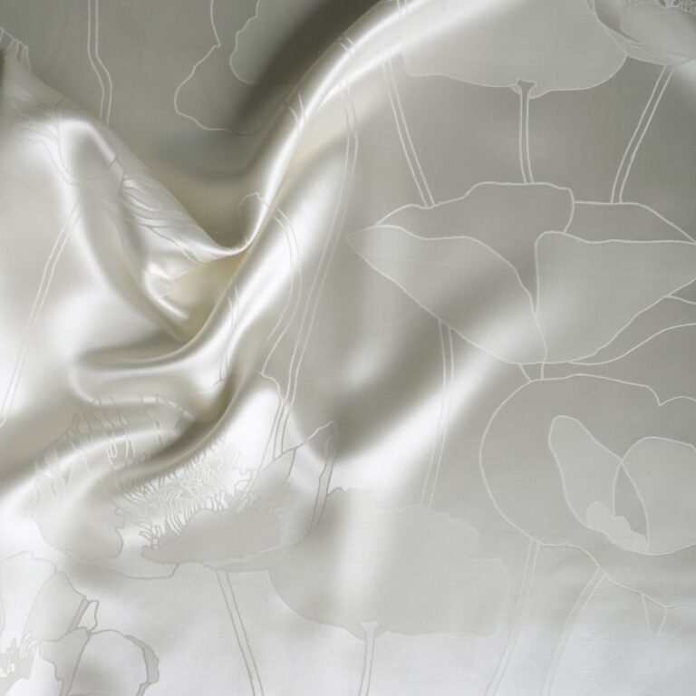 A white sheet with a floral pattern on it.