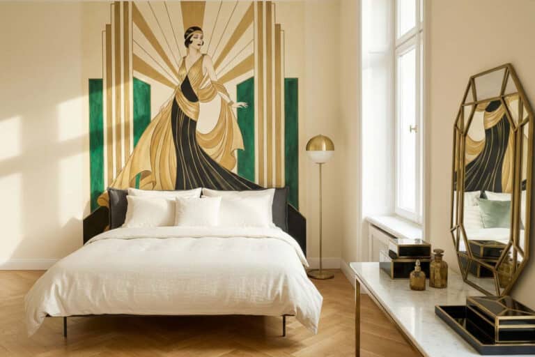 A bedroom with a neatly made bed and a painting on the wall.