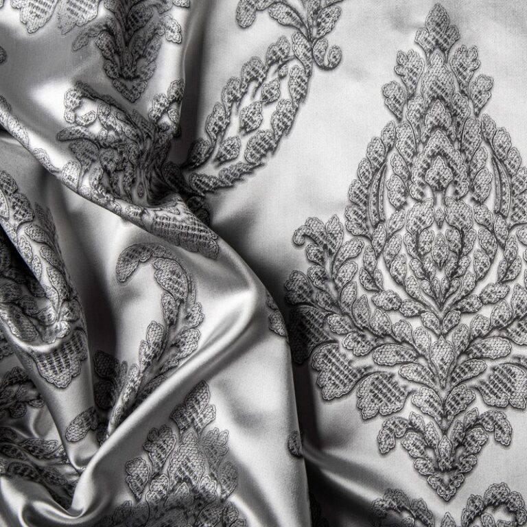 A black-and-white photo of a bedsheet.