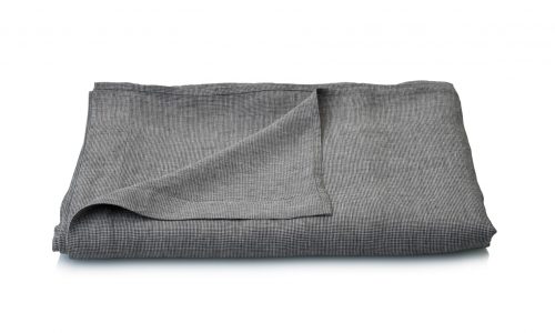 A neatly folded Arctica linen bed sheet from Geniksa in gray with a subtle textured pattern is displayed on a white background.