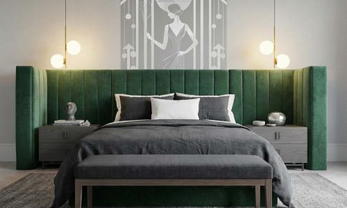 Ein Schlafzimmer mit einem grünen Kopfteil und einem grauen Bett.