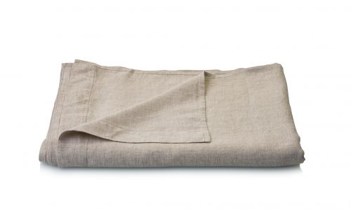 A neatly folded beige linen bed sheet against a plain white background.
